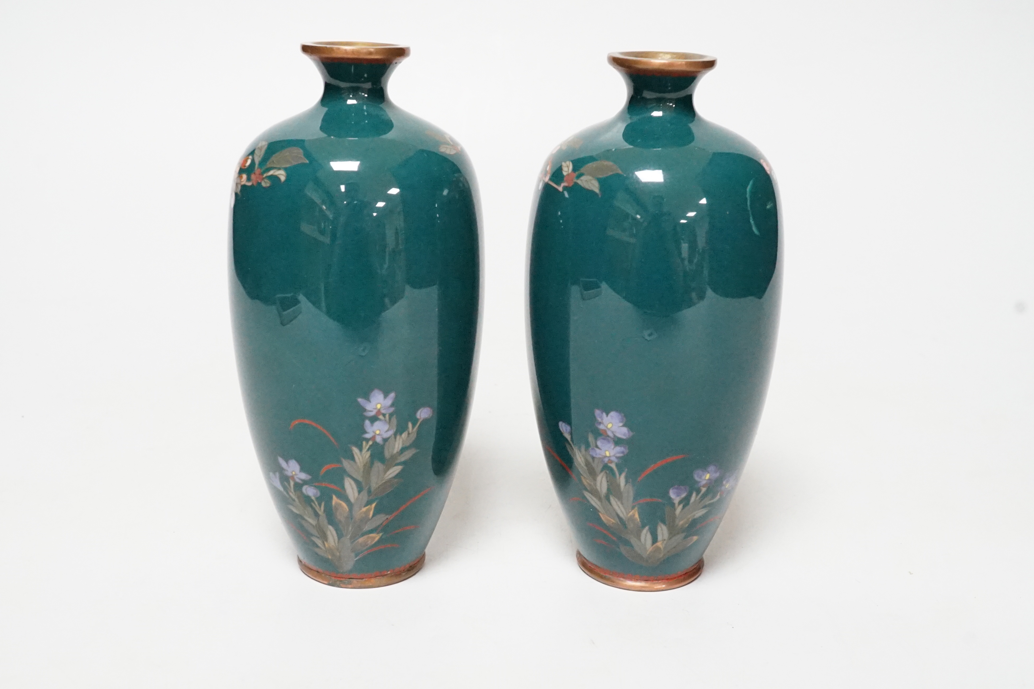 A small pair of Japanese silver wire cloisonné enamel green ground vases, early 20th century, 14cm